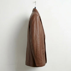 Side profile of men’s brown leather blazer with tailored fit