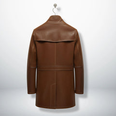 Back view of men’s long brown leather winter coat with yoke detail