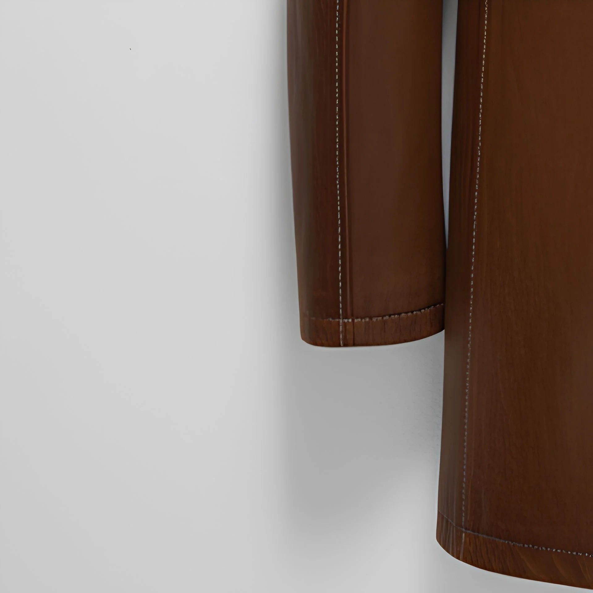 Sleeve hem and stitching detail on men’s brown leather winter coat
