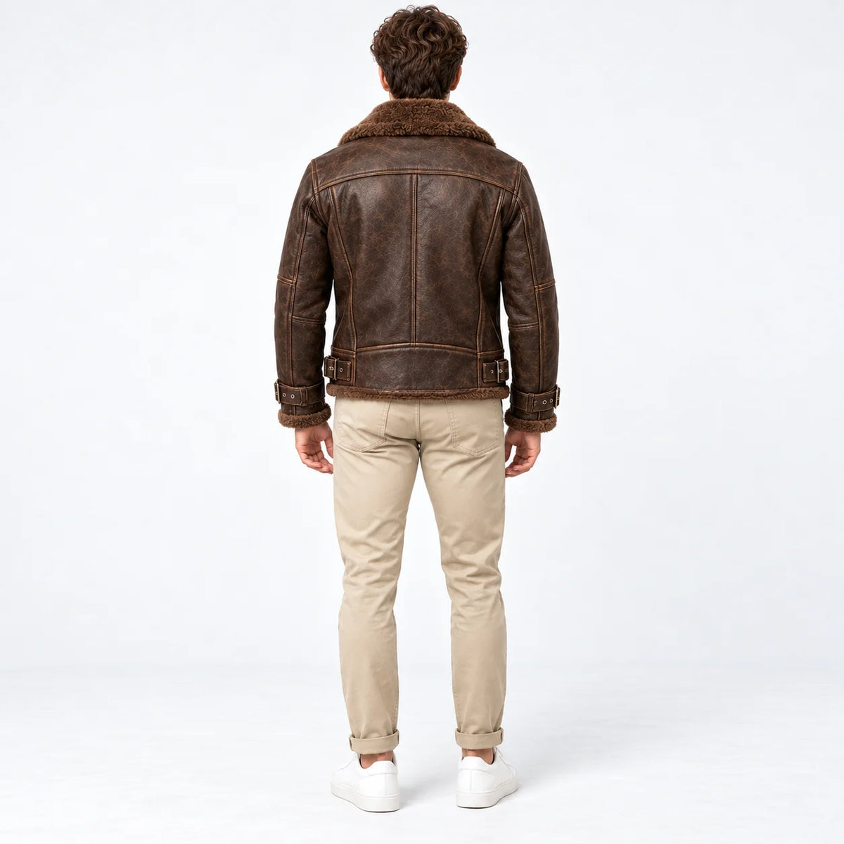 Back model view of espresso brown leather aviator jacket showing panelled construction and faux fur collar