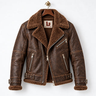 Front hanger view of brown sheepskin aviator jacket with wide faux fur collar, asymmetric metal zip and pockets