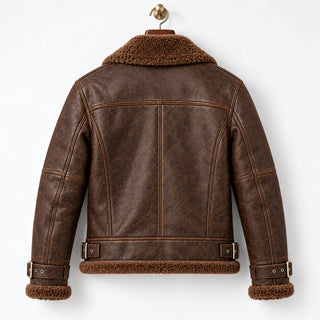 Rear hanger view of brown leather aviator jacket showing shoulder yoke, vertical seams and waist buckle tabs
