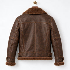 Rear hanger view of brown leather aviator jacket showing shoulder yoke, vertical seams and waist buckle tabs