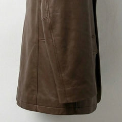 Hem and side panel stitching detail on men’s brown leather blazer