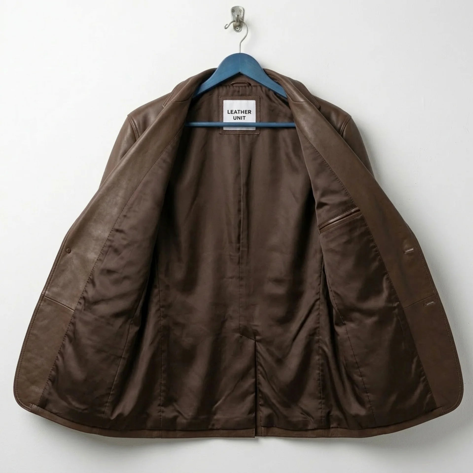 Inside lining of men’s brown leather blazer with interior pocket