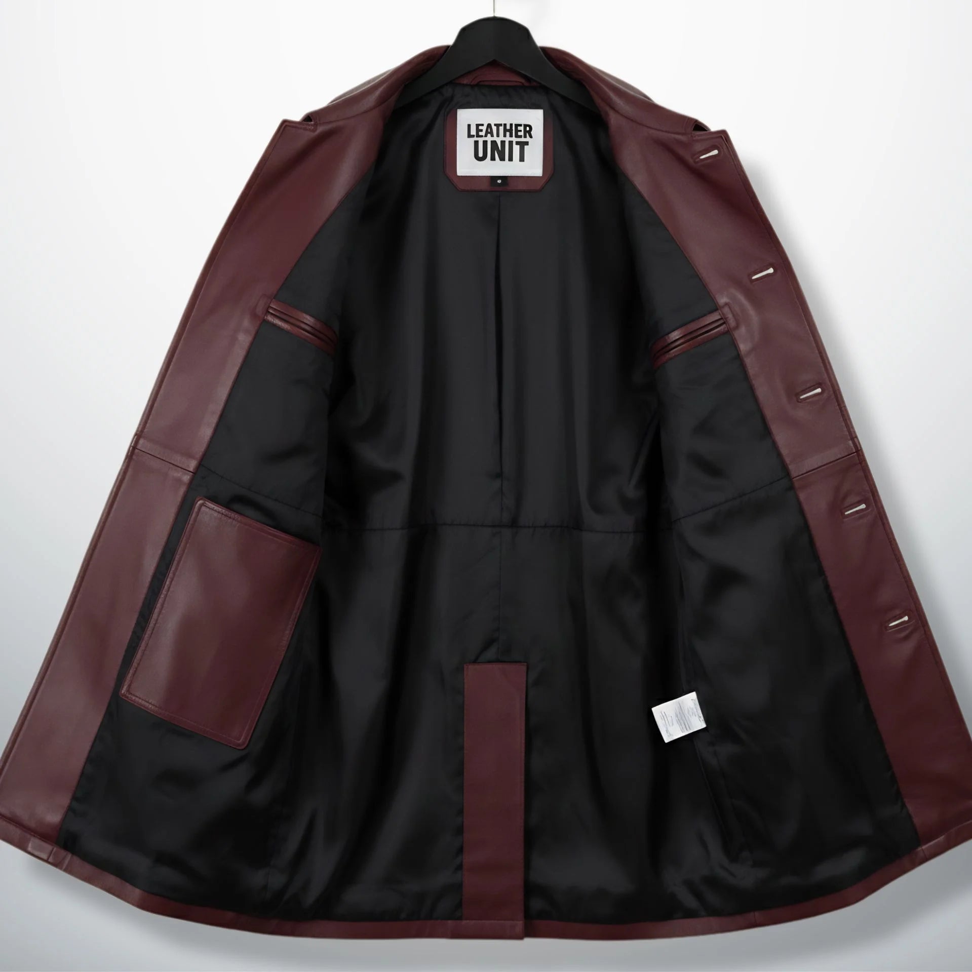 Inside lining of men’s burgundy leather car coat showing pockets