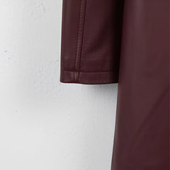 Sleeve hem detail on men’s maroon leather coat