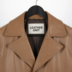 Close up of wide notch lapel and Leather Unit label on camel leather coat.