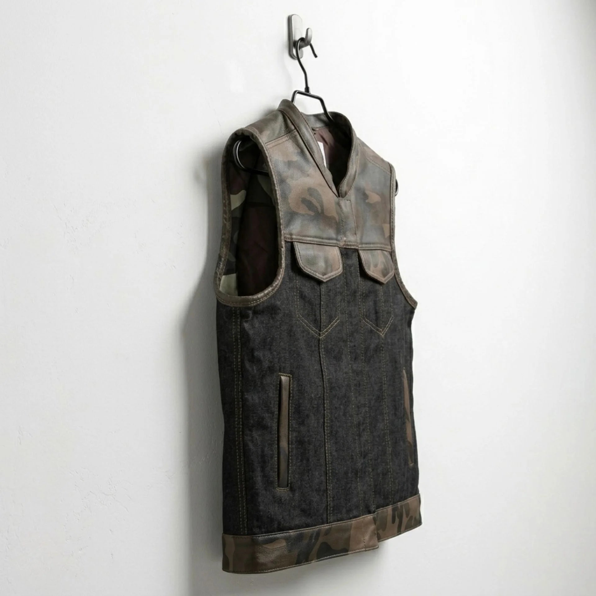 Side angle of men's camo and denim motorcycle club vest