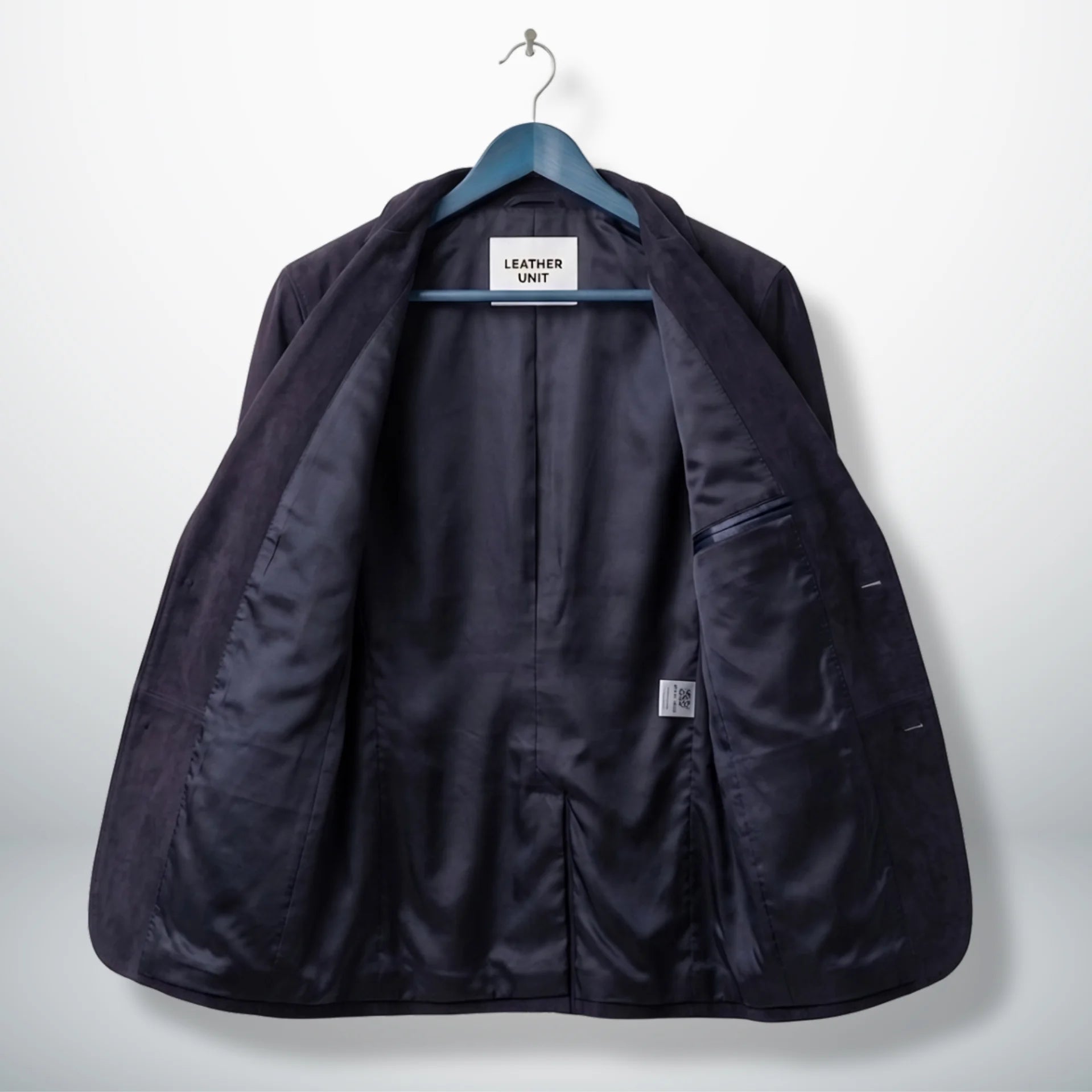 Inside lining of men’s purple suede leather blazer showing interior pockets