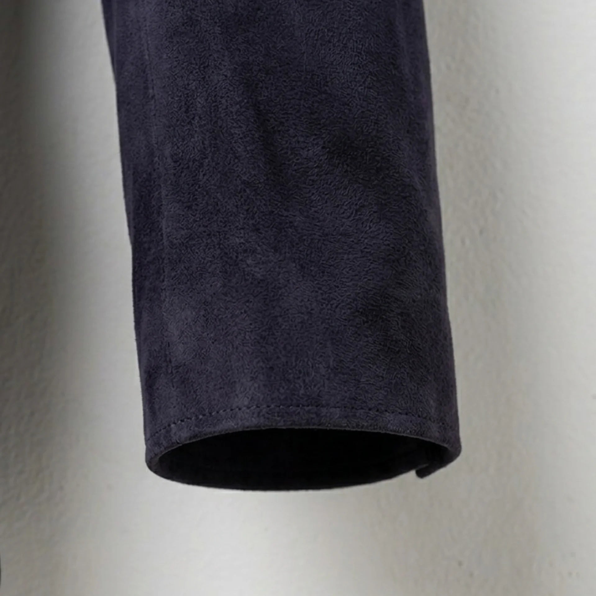 Sleeve cuff detail on men’s dark purple suede leather blazer