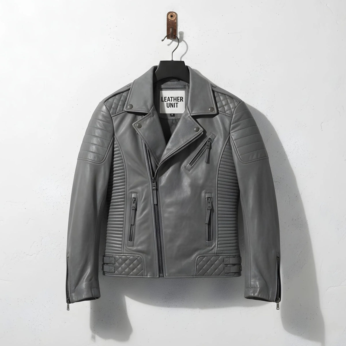 front view of men's grey leather biker motorcycle jacket with quilted panels.
