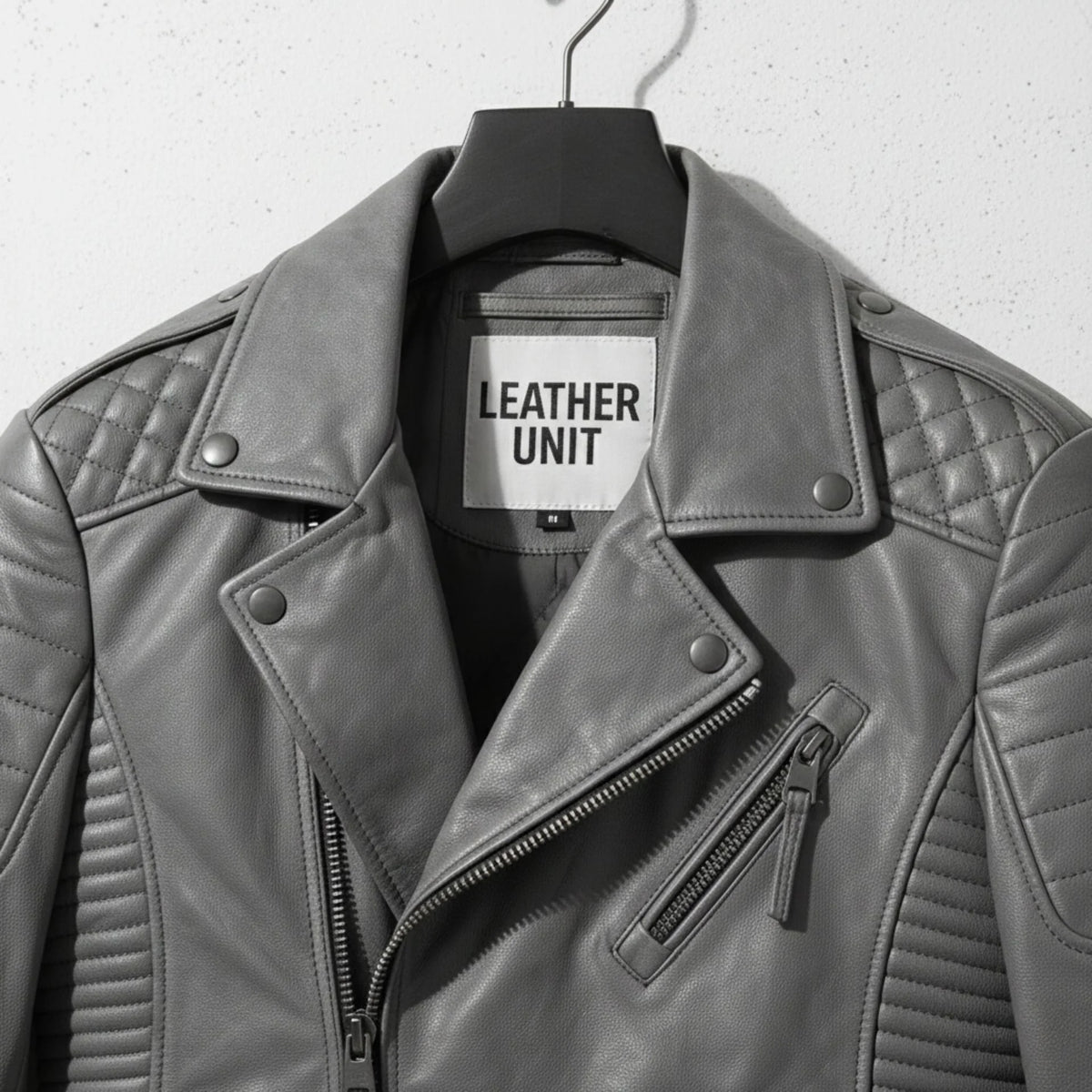 close up of collar and chest zipper pocket on men's grey leather biker jacket by Leather Unit.