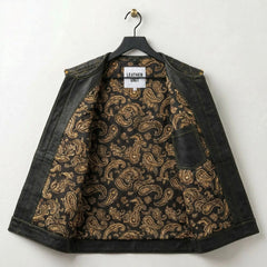 Inside of men's leather biker vest showing black and gold paisley lining and pocket