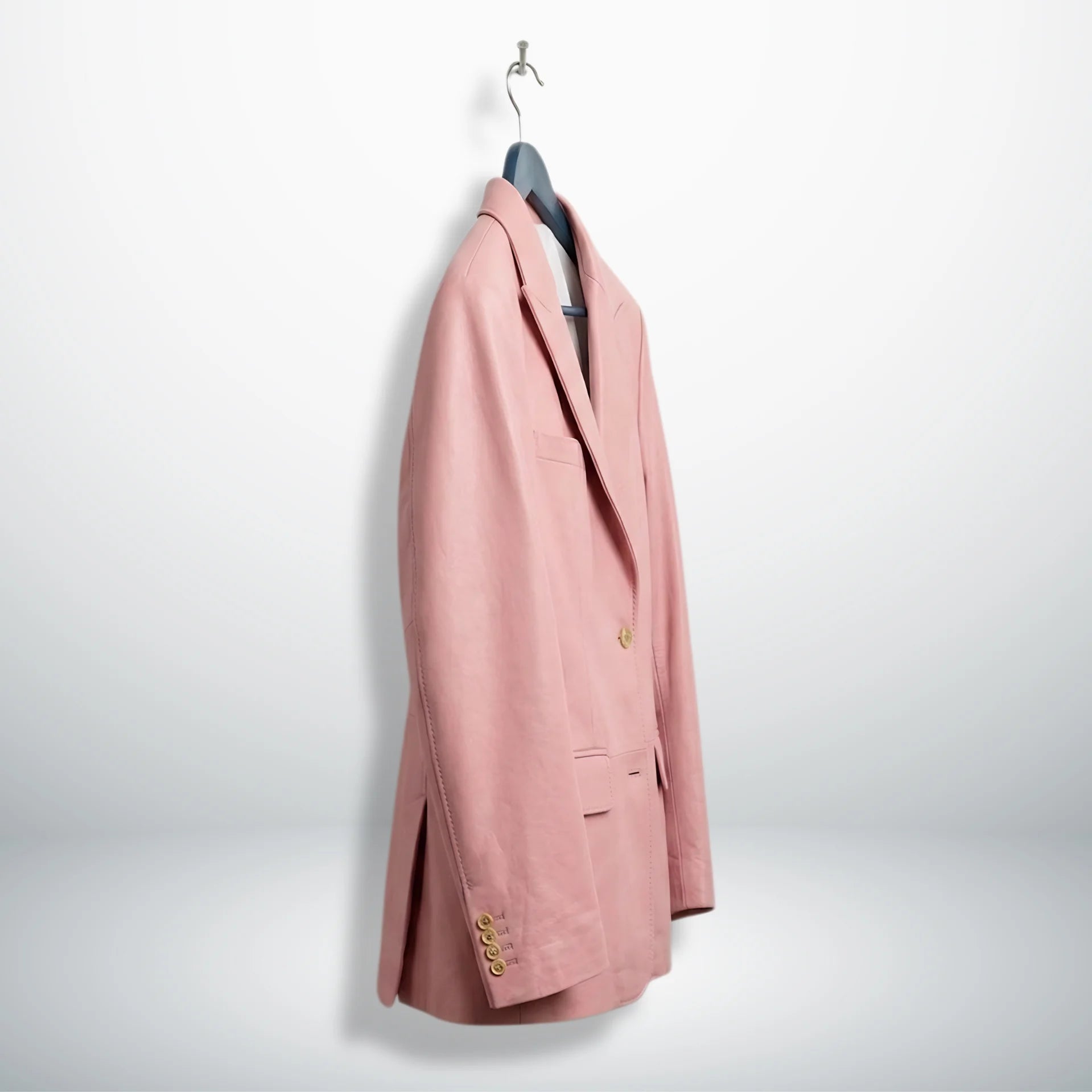 Side angle of men’s pink leather blazer jacket on hanger