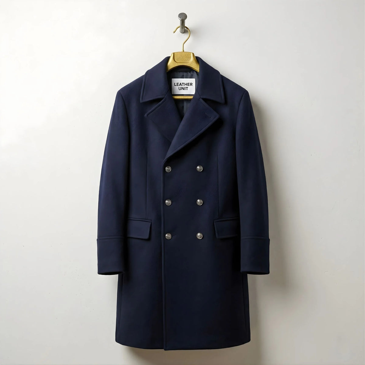 Front view of men's navy double breasted wool overcoat by Leather Unit.