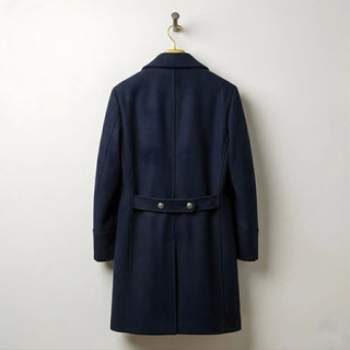 Back view of men's navy wool overcoat with buttoned half belt.
