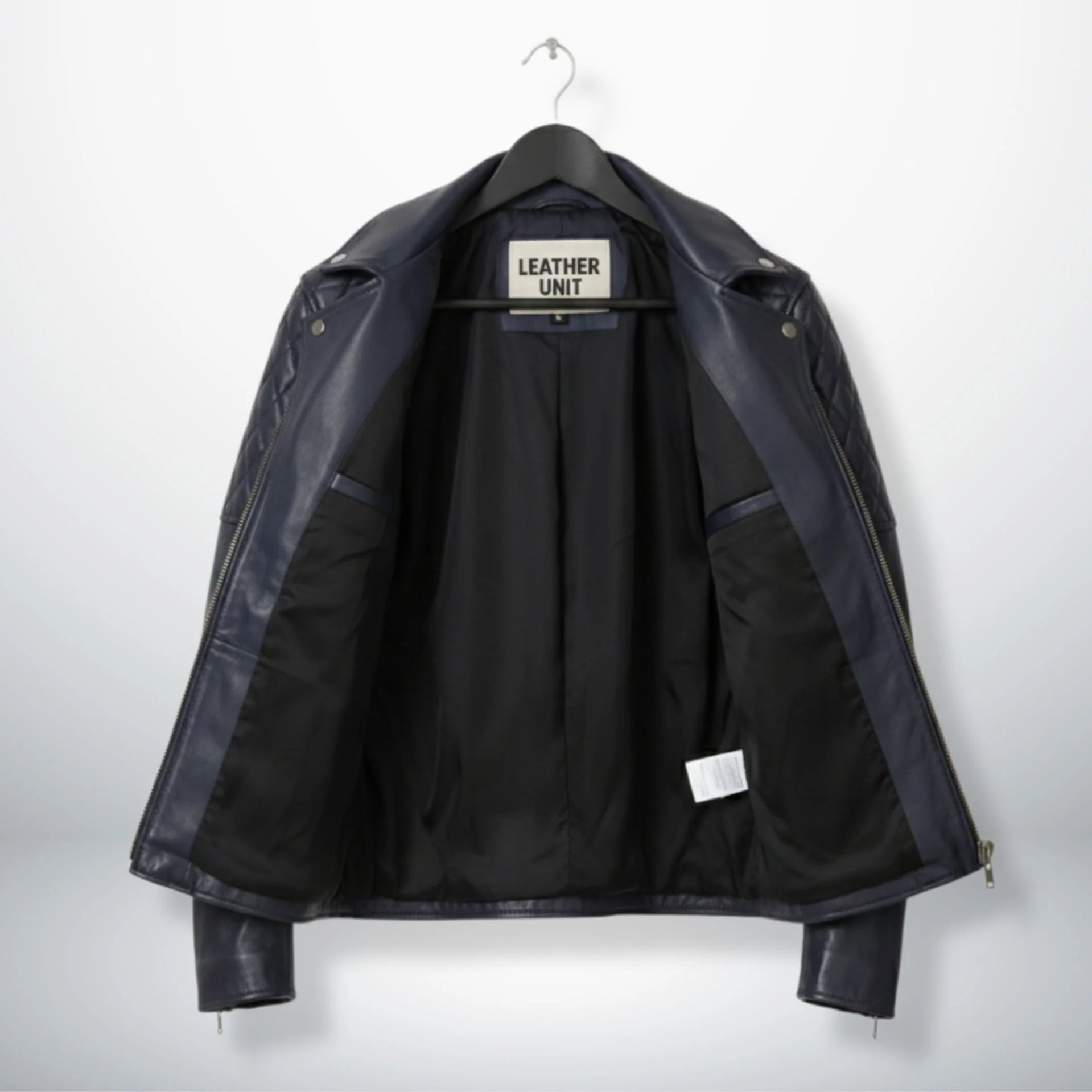 interior of men's navy leather biker jacket showing black lining.