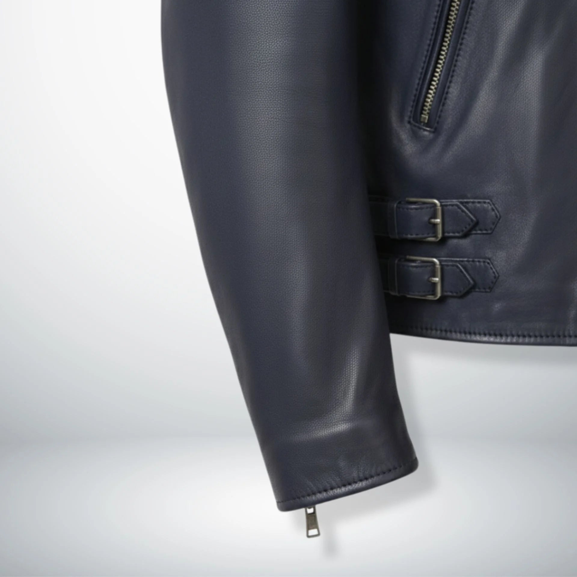 sleeve and cuff zipper detail on men's navy leather biker jacket.