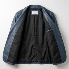 Interior of men's navy leather blazer showing black lining and inner pocket.