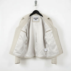 interior of men's off white leather jacket showing smooth light lining.