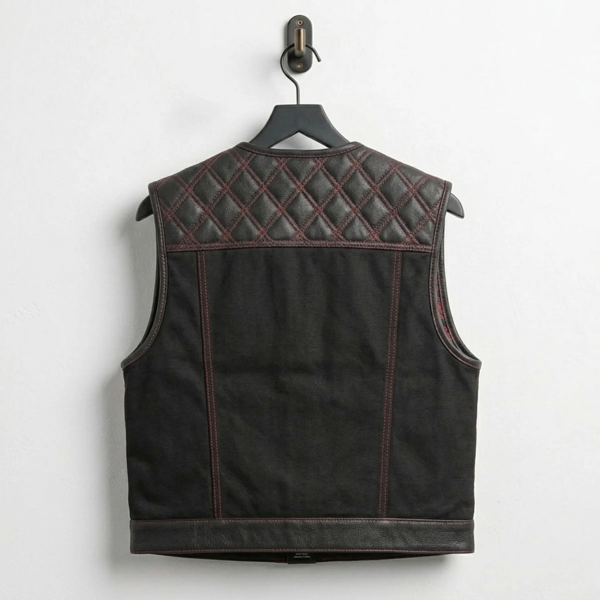 Back view of men's Nova Lowside leather and canvas vest with diamond quilted yoke