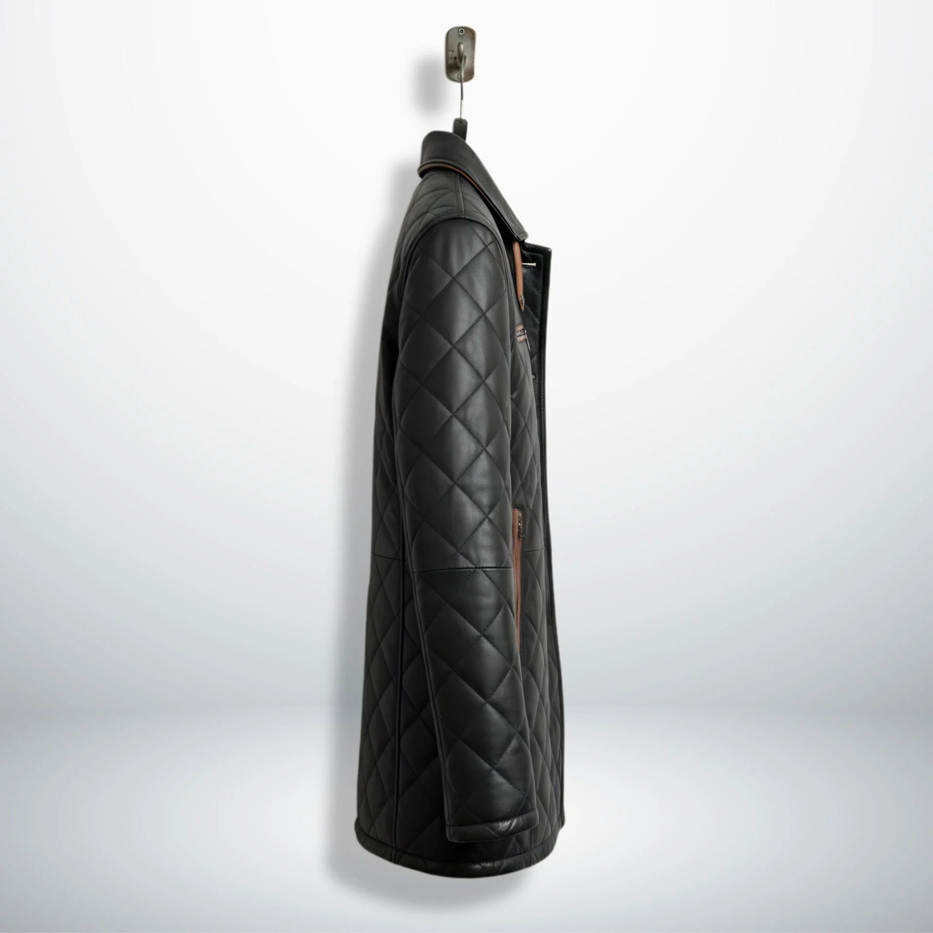 Side profile of men’s black quilted leather car coat