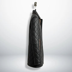 Side profile of men’s black quilted leather car coat
