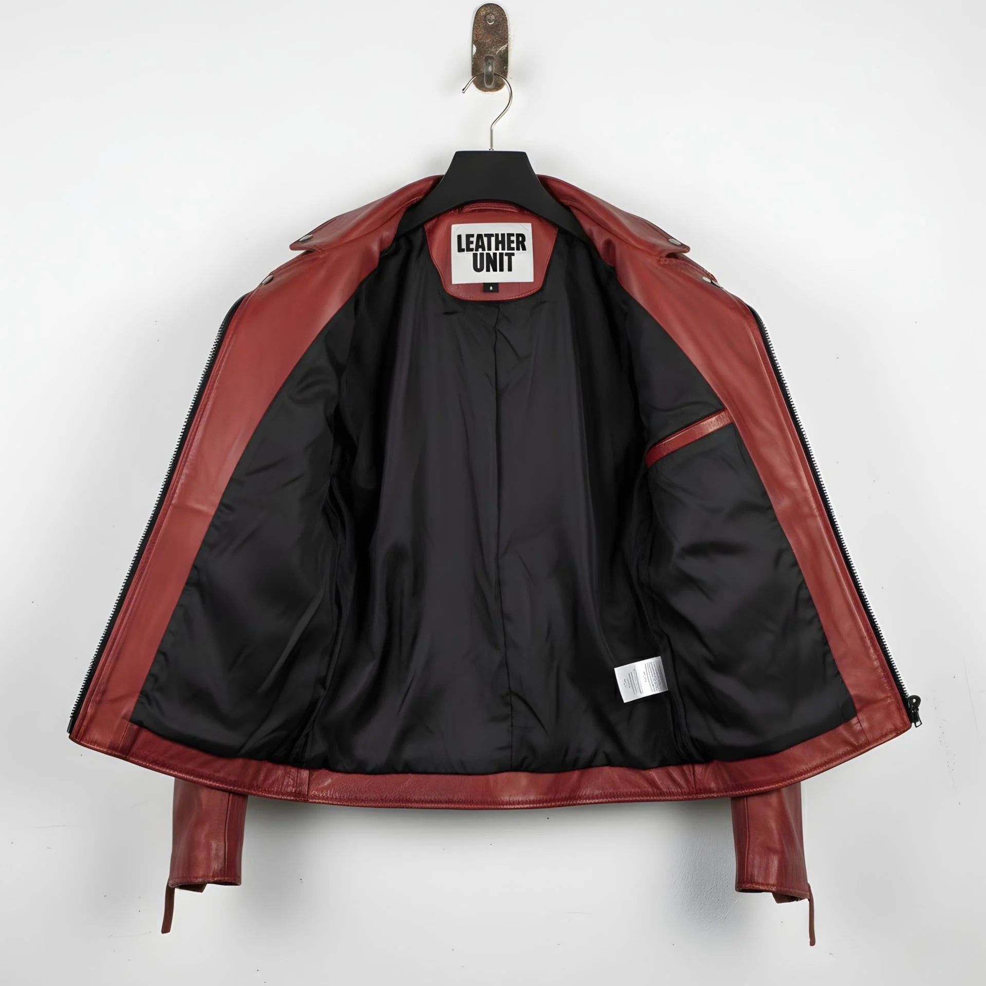 interior of men's red leather biker jacket showing black lining and inside pocket.