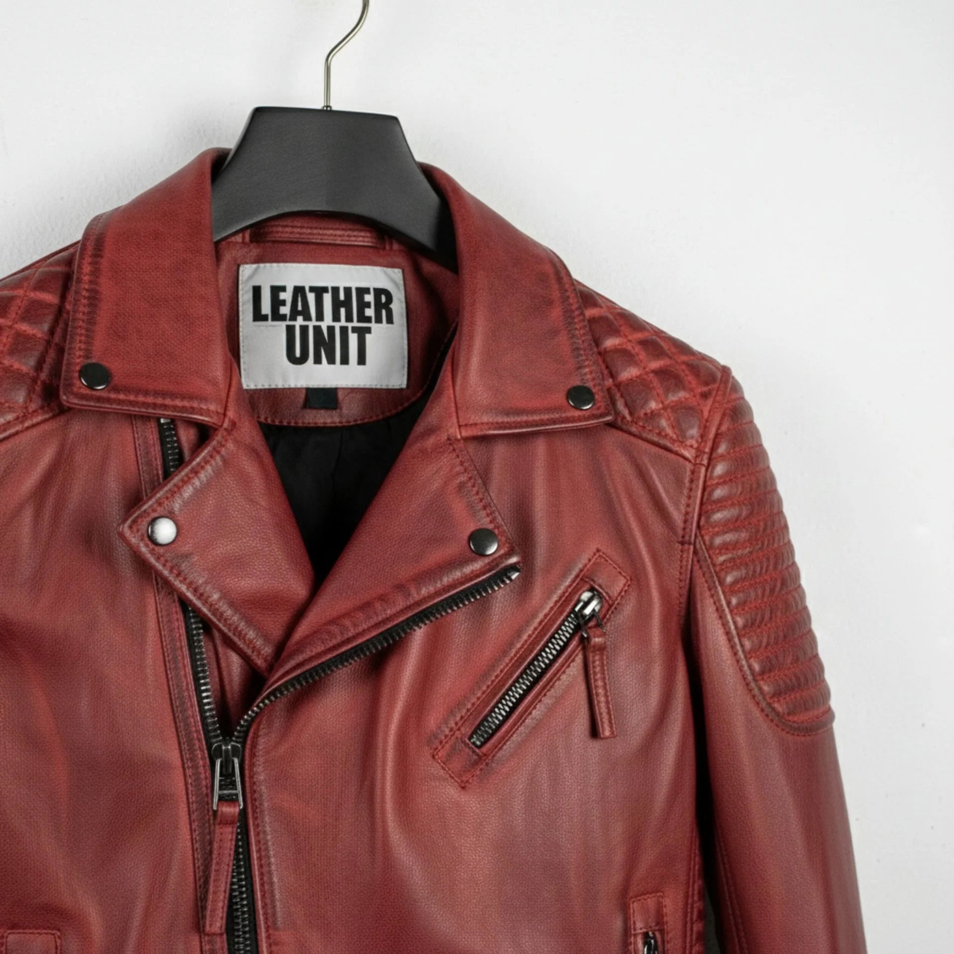 close up of collar and chest zipper pocket on men's red leather biker jacket by Leather Unit.