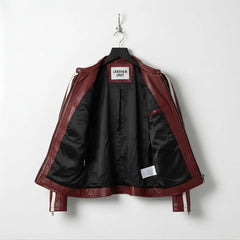 Interior view showing black lining and inside pocket of men's red leather jacket.