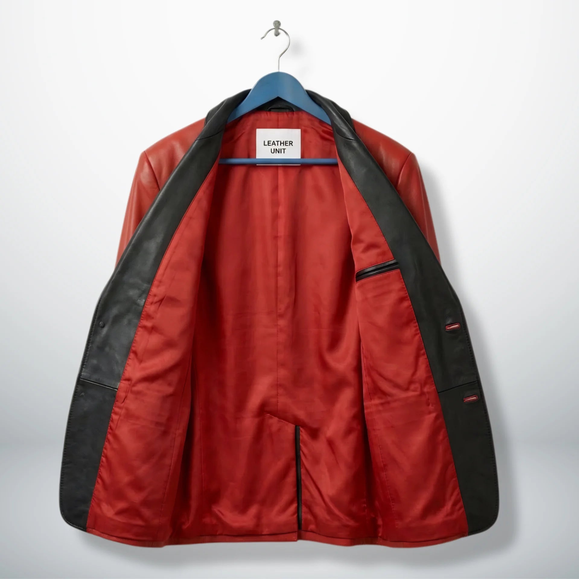 Inside lining of men’s red leather blazer showing interior pocket
