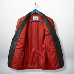 Inside lining of men’s red leather blazer showing interior pocket