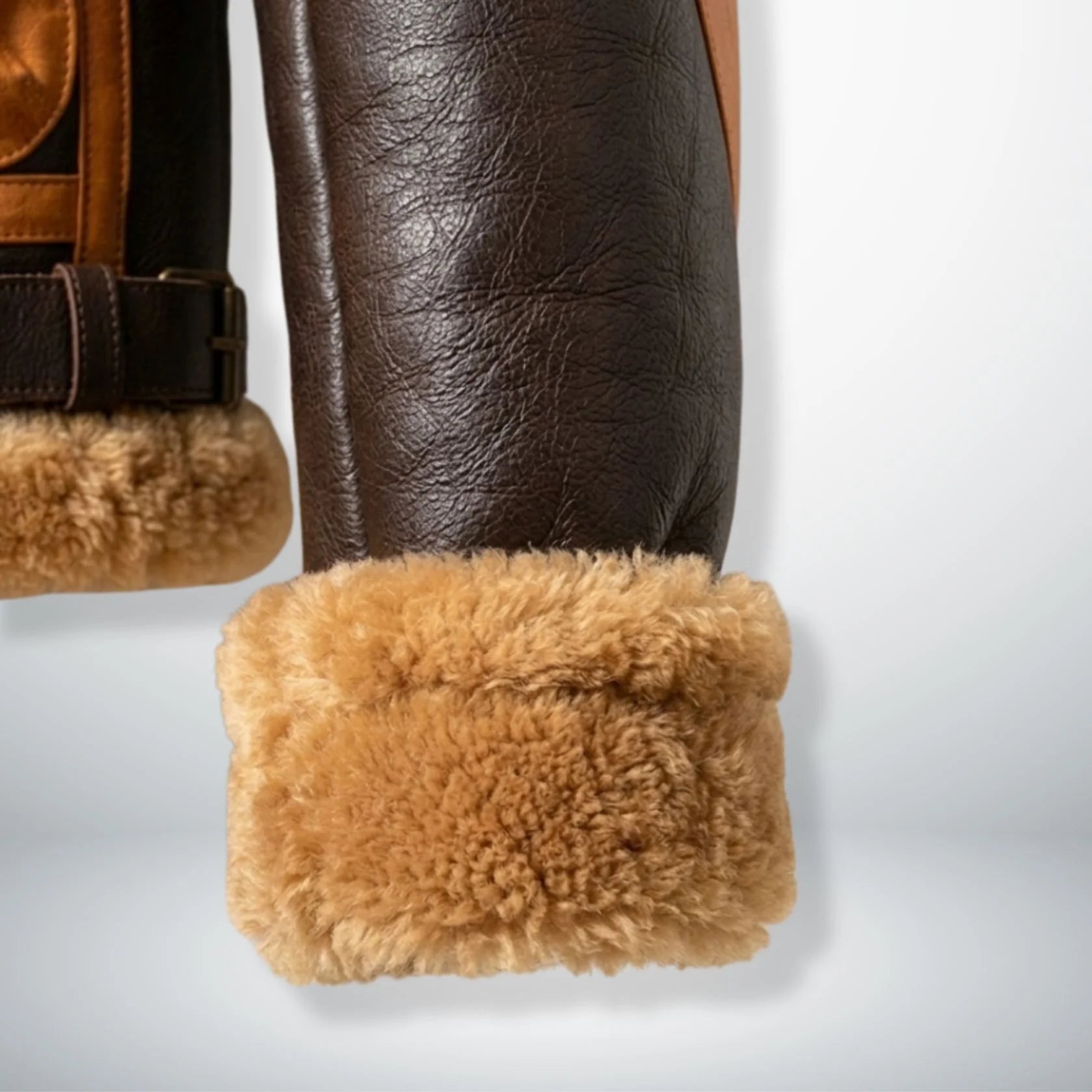 close up fur cuffs and rounded hem on mens aviator bomber leather jacket.