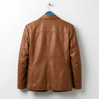 Back view of men's tan leather blazer showing clean seams.