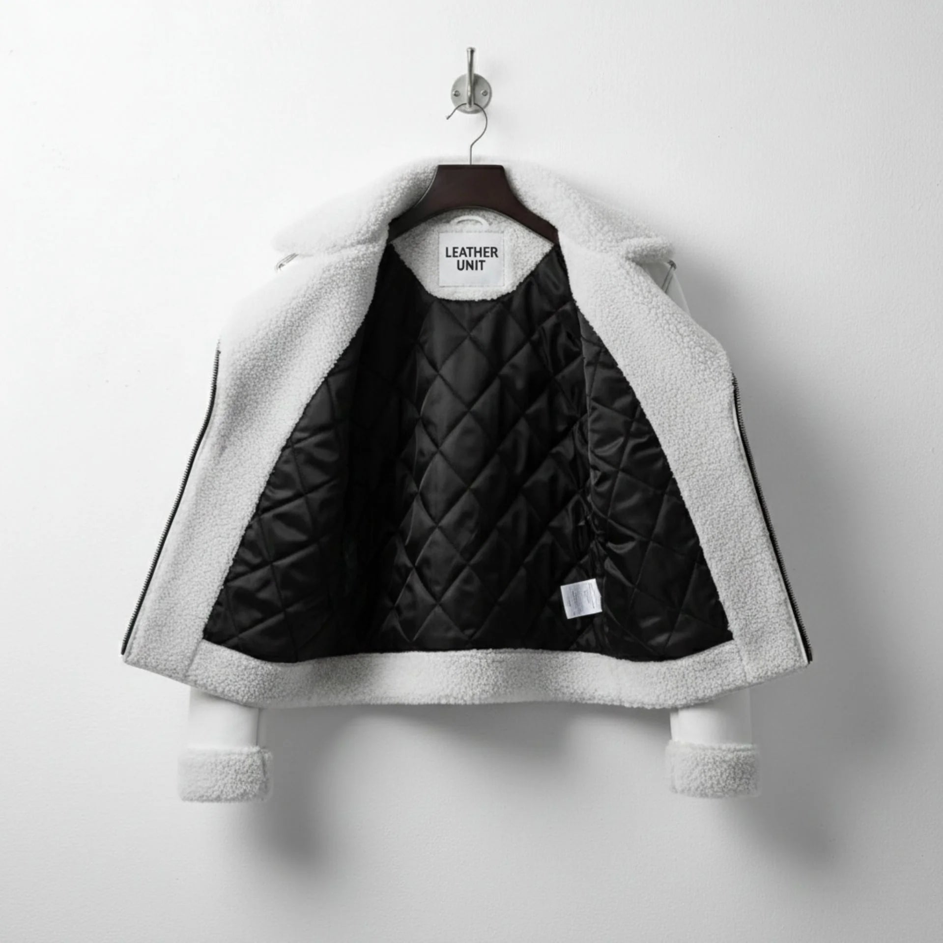 interior of mens white shearling leather jacket with quilted lining.