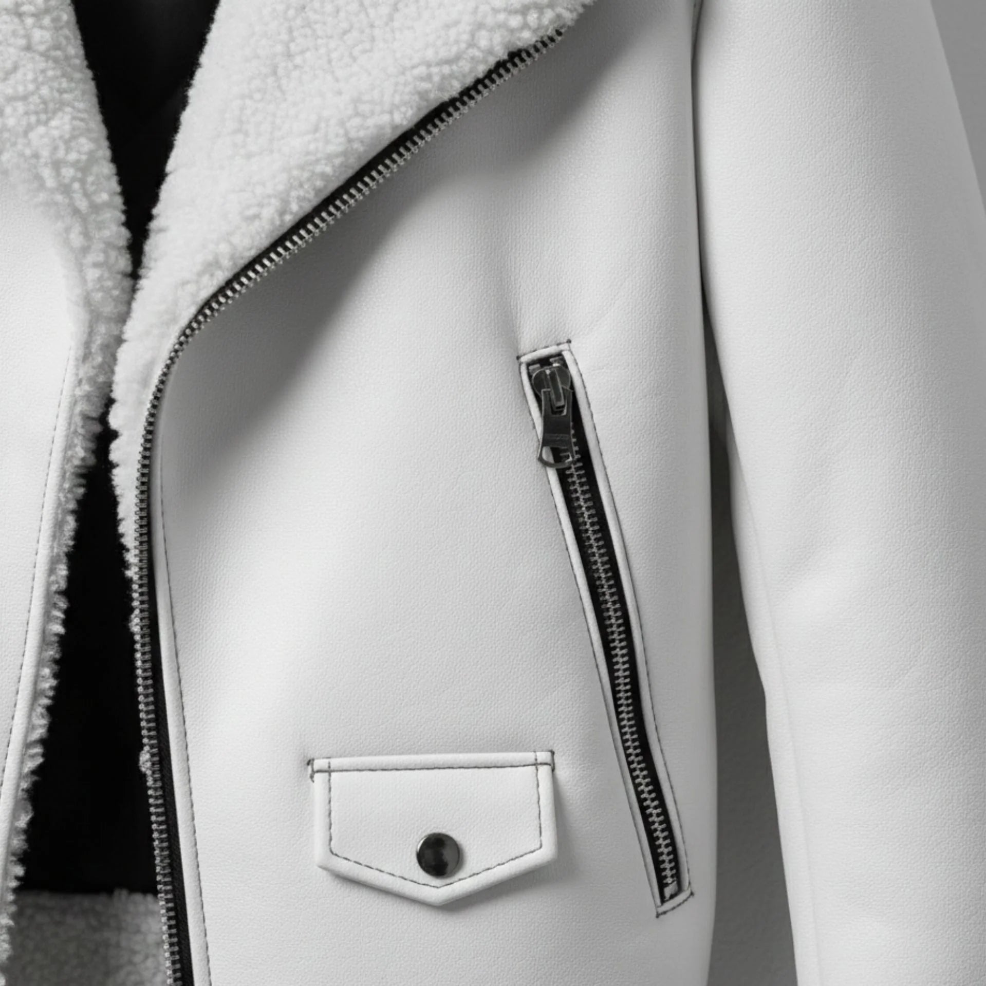 close up zipper pocket and flap pocket on mens white shearling leather jacket.