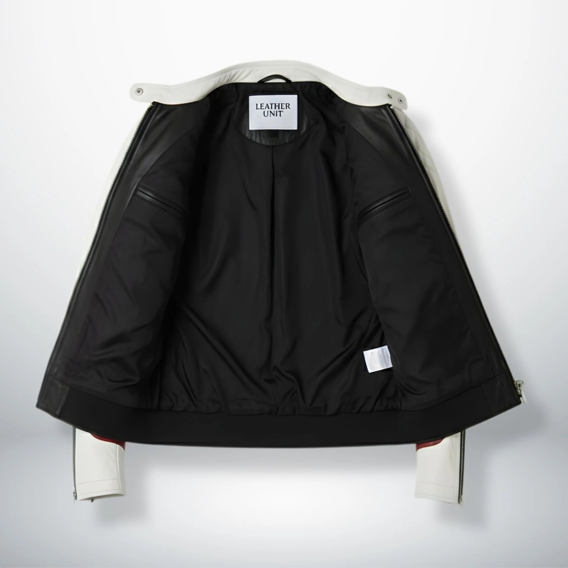 interior of men's white and black leather jacket showing black lining and inside pockets.
