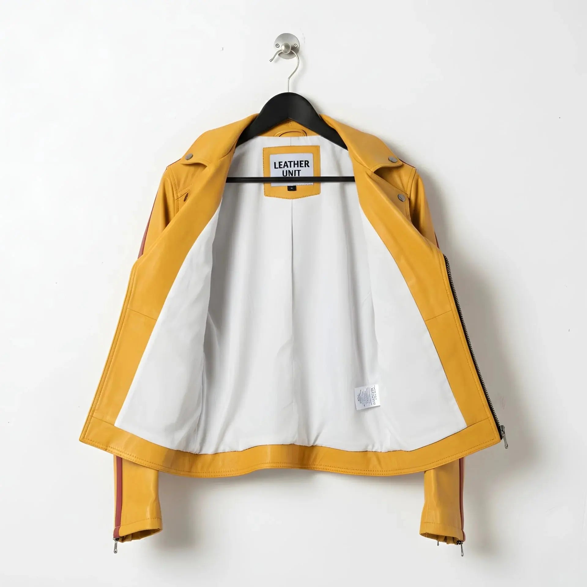 inside of men's yellow leather motorcycle jacket showing white lining.