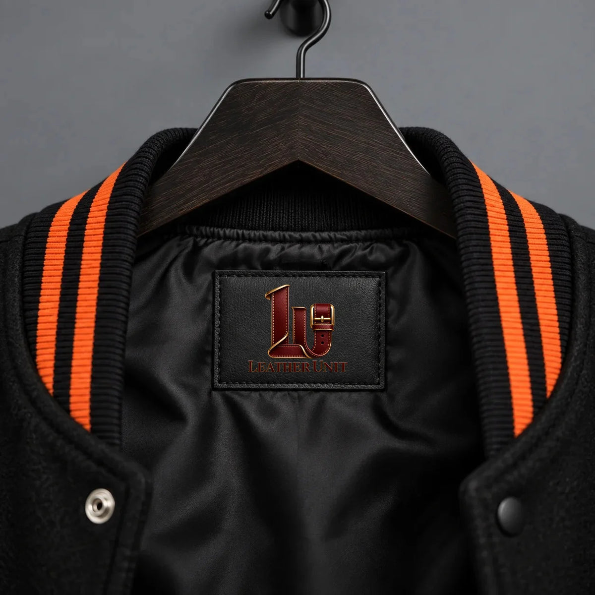 Close-up of Midnight Coven interior branding, black lining and black-orange striped varsity collar