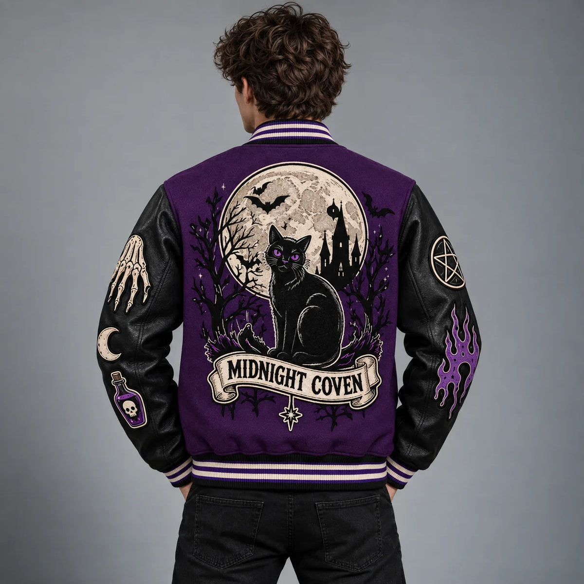 Back model view of purple Halloween varsity jacket with black cat, full moon, bats and haunted castle artwork