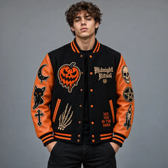 Studio front view of Midnight Ritual black Halloween varsity jacket with pumpkin, skull and skeletal hand embroidery