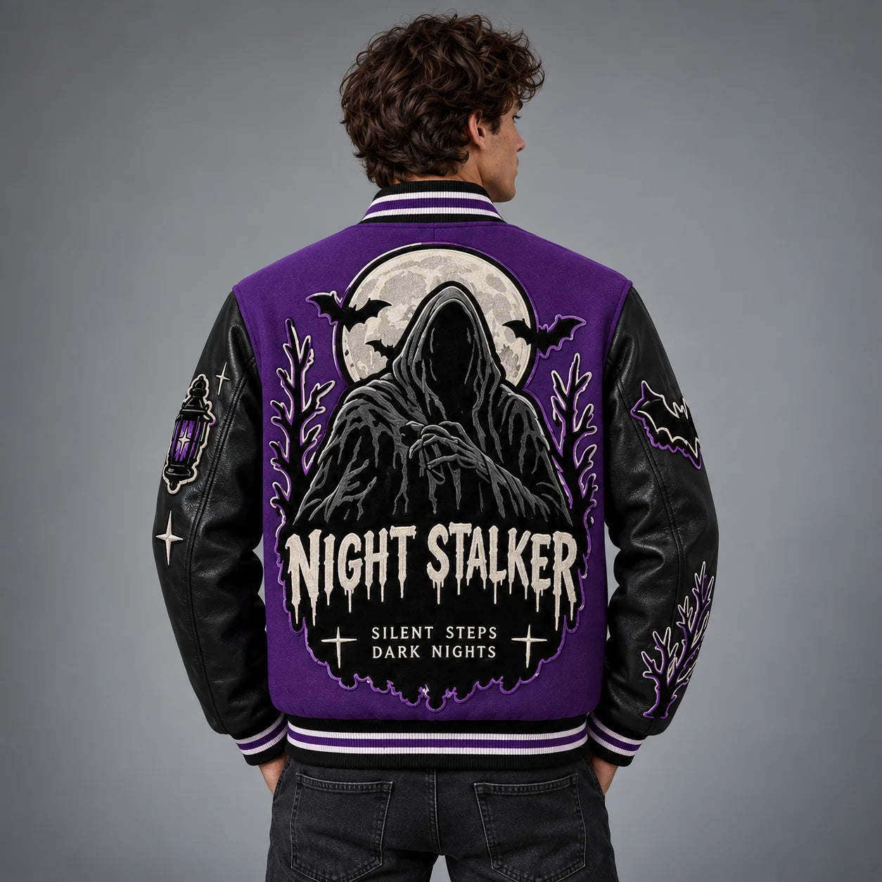 Back model view of Night Stalker varsity jacket featuring hooded figure, full moon, bats and gothic embroidery