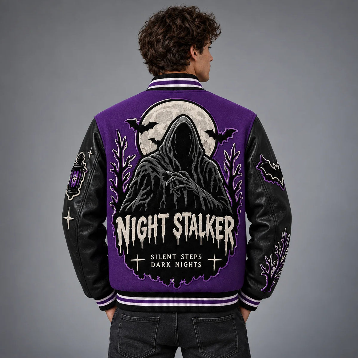 Back model view of Night Stalker varsity jacket featuring hooded figure, full moon, bats and gothic embroidery