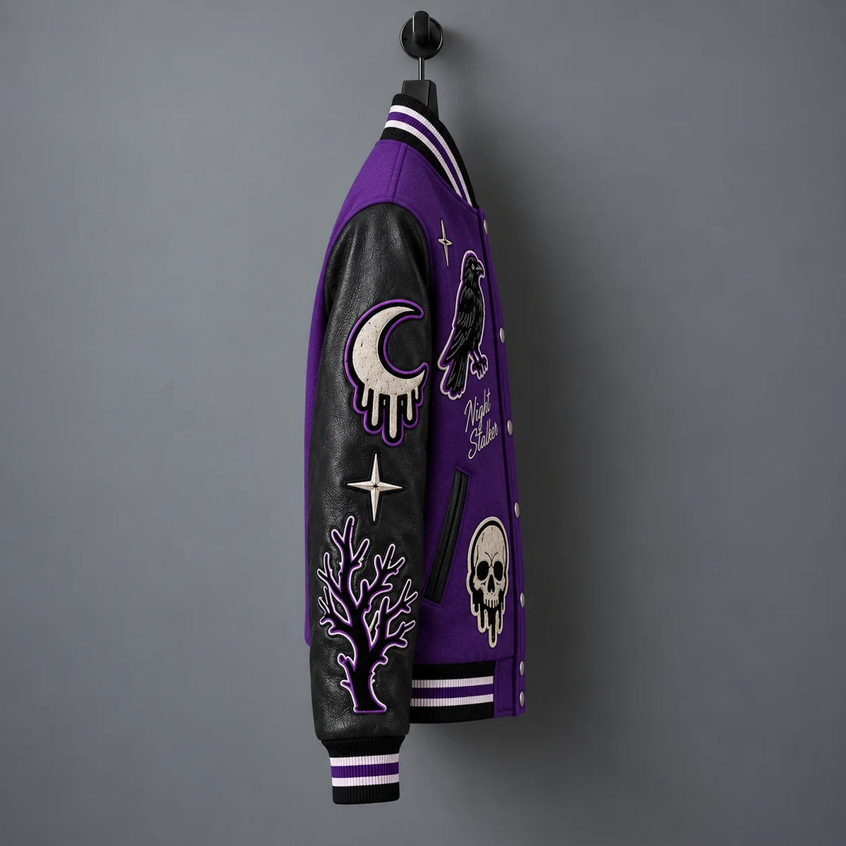 Side view of Night Stalker jacket showing black genuine leather sleeve with moon and branch embroidered patches