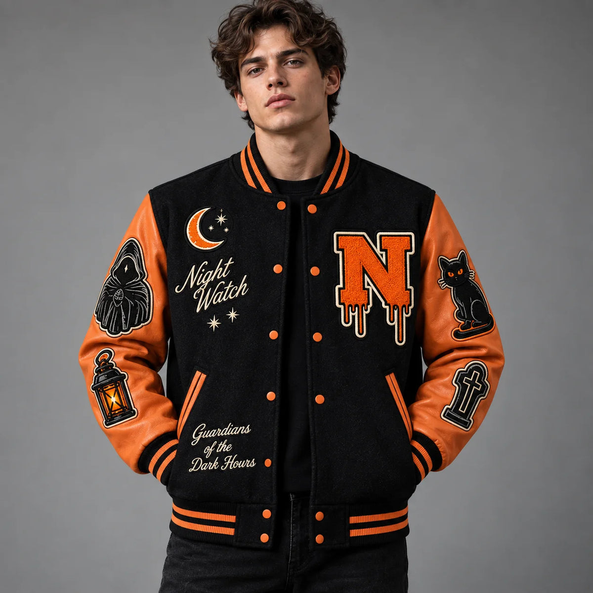 Studio front view of Grim Reaper Halloween varsity jacket with black body, orange leather sleeves and Night Watch patches