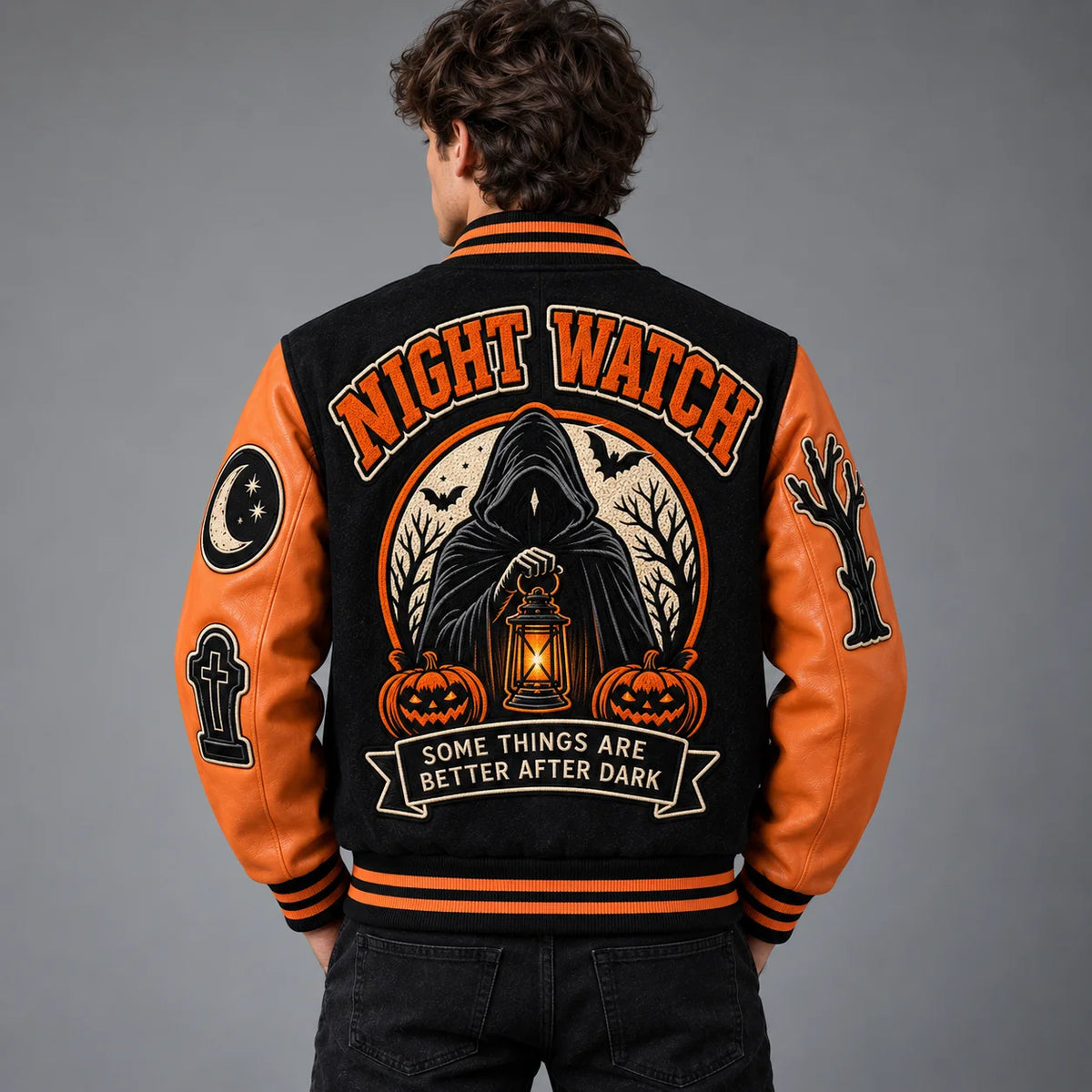 Model back view of Night Watch Halloween varsity jacket with large Grim Reaper, lantern, pumpkins and bat embroidery
