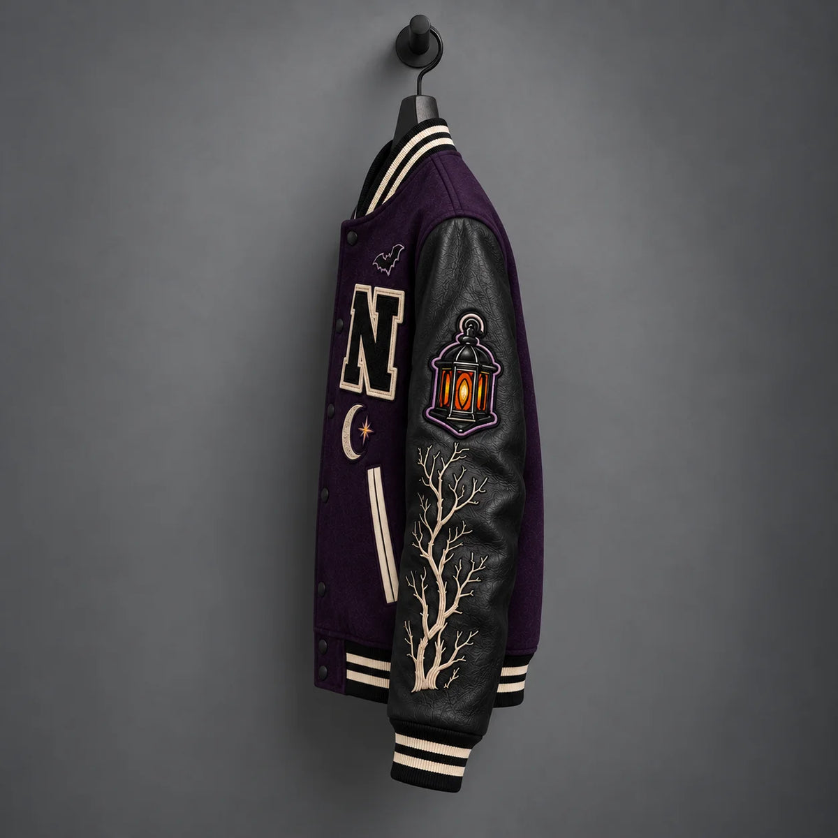 Side view of Night Watchers jacket highlighting matte-black leather sleeve, orange lantern and embroidered bare branches