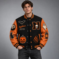 Studio model wearing black and orange Halloween varsity jacket with pumpkin, skull, bat and ghost embroidery