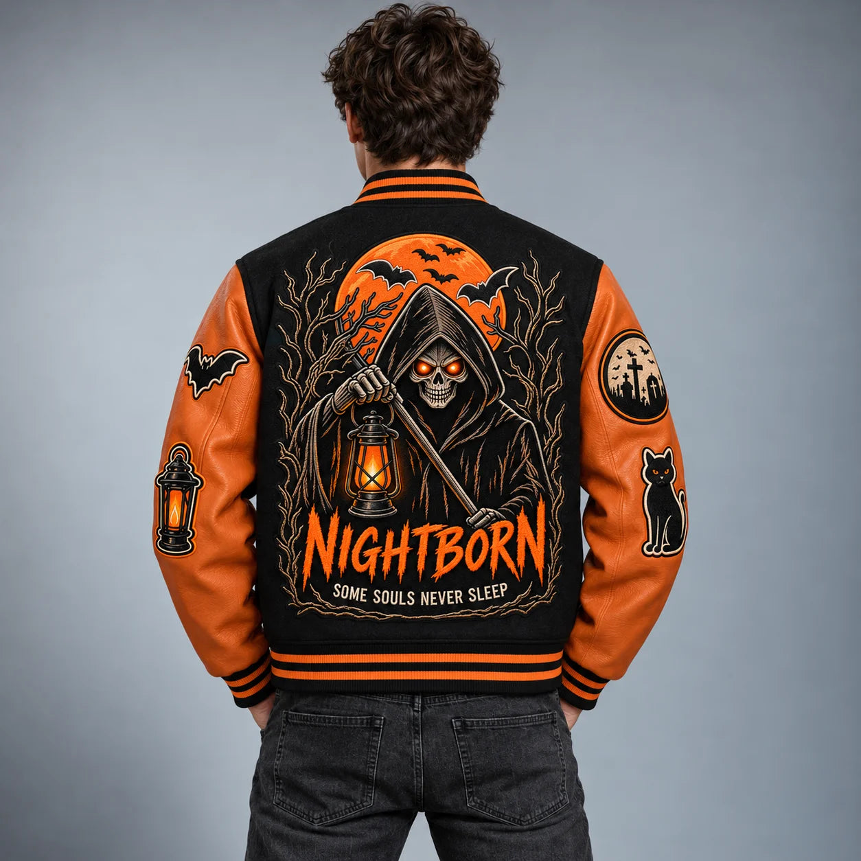 Back model view showing Nightborn grim reaper, orange moon, lantern and bat embroidery on Halloween varsity jacket